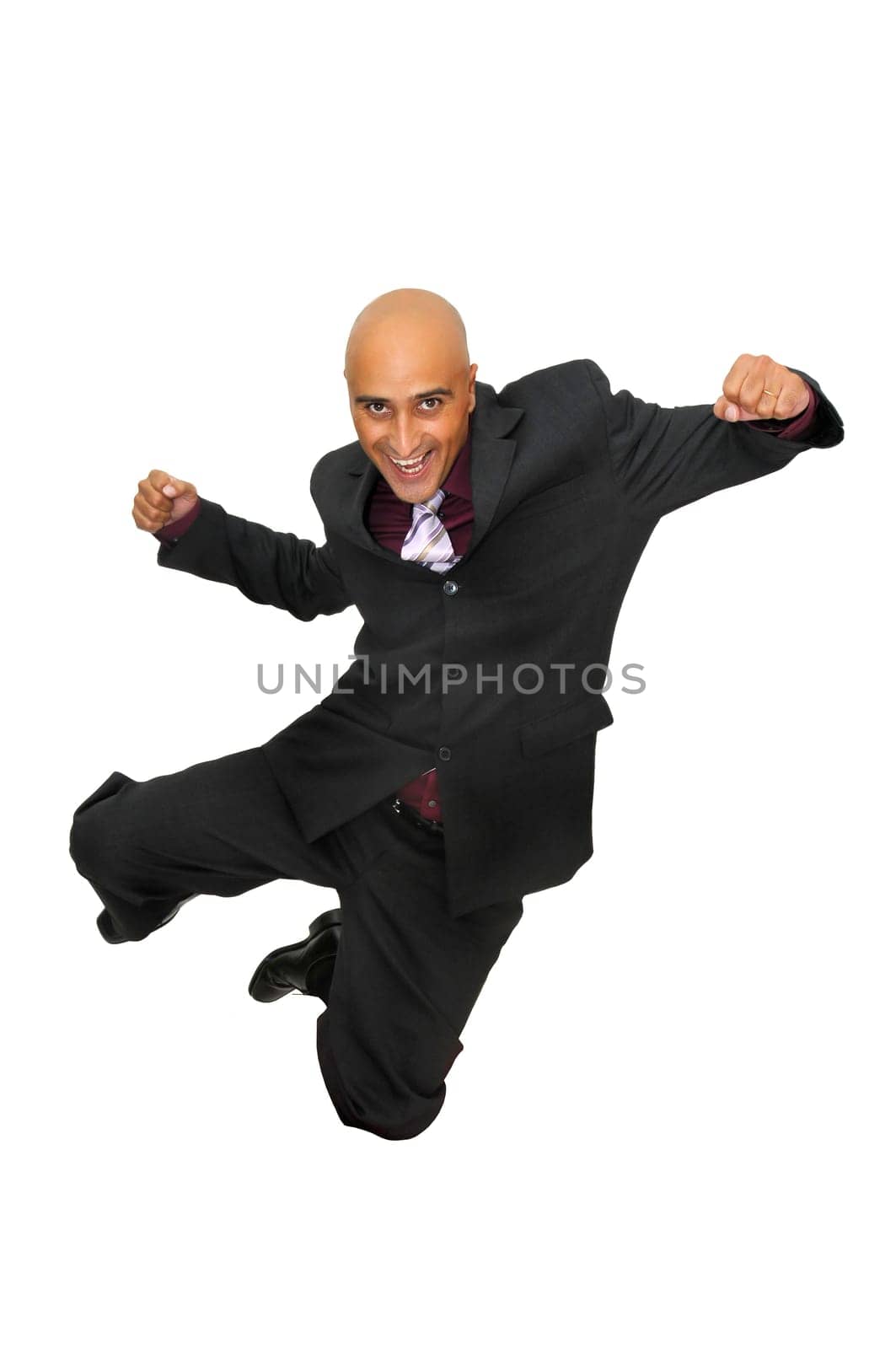 Happy businessman jumping against a white background