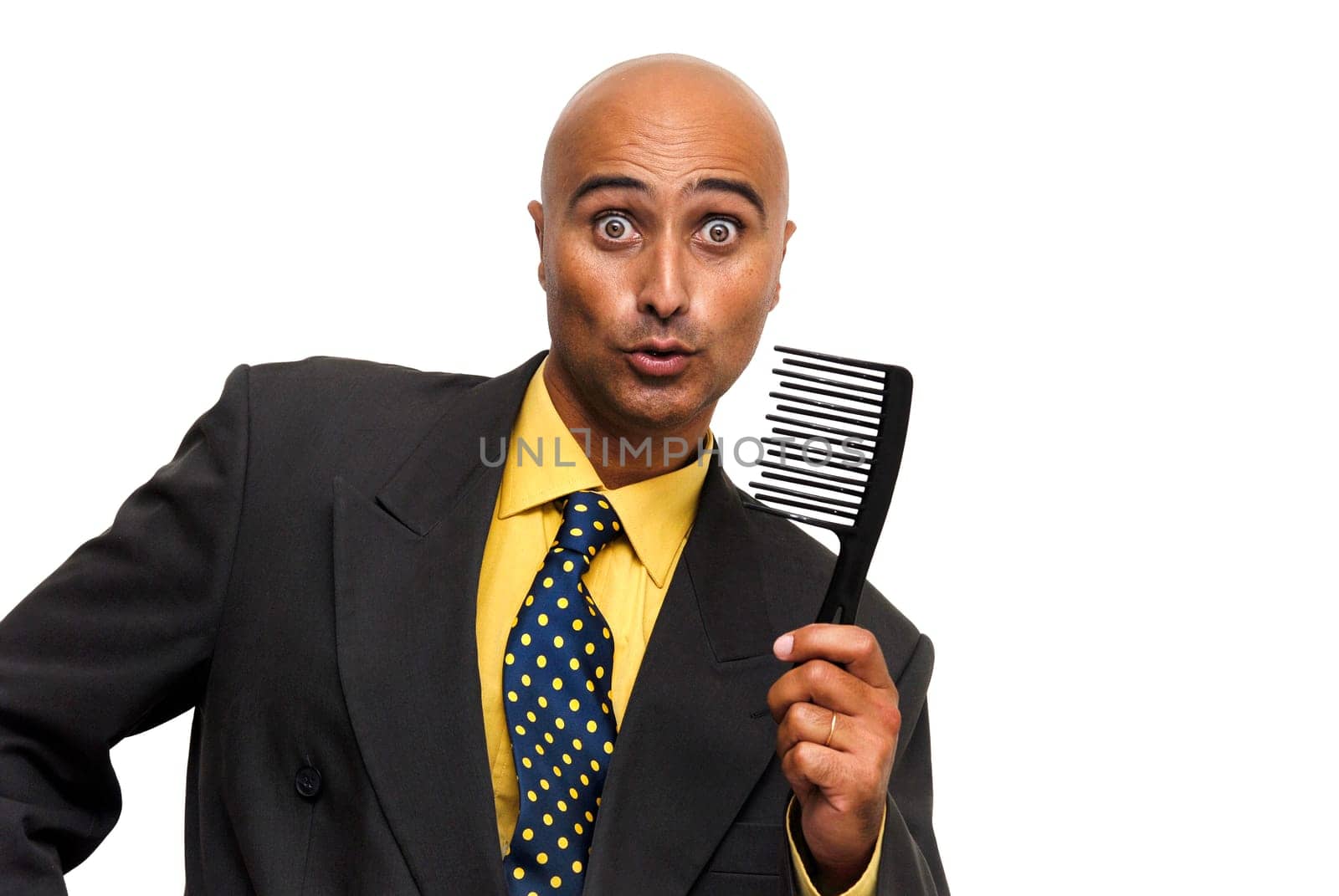 Bald businessman with a comb isolated against a white background