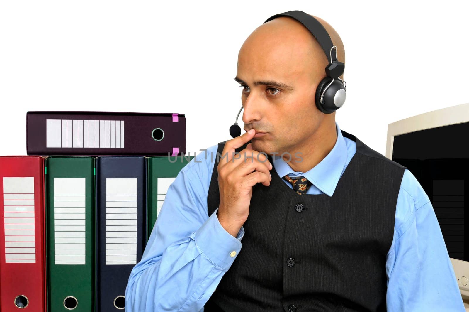 Thinking businessman with headset in the office isolated in white