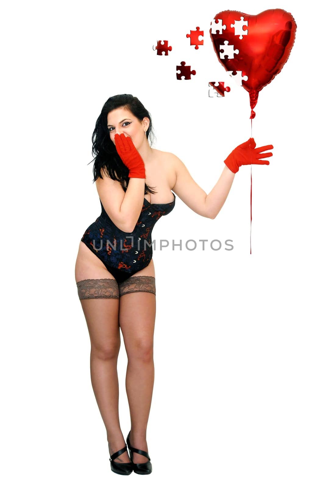 Sexy woman with red balloon isolated in white