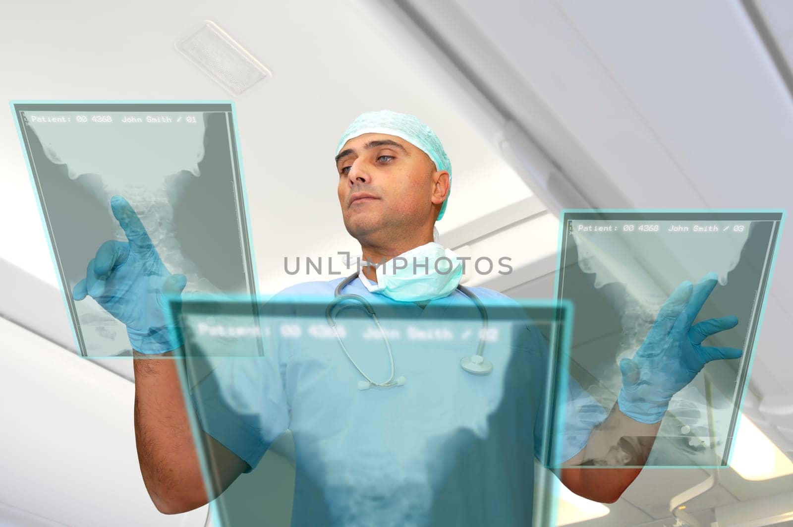 Doctor in uniform with high-tech screen in the hospital