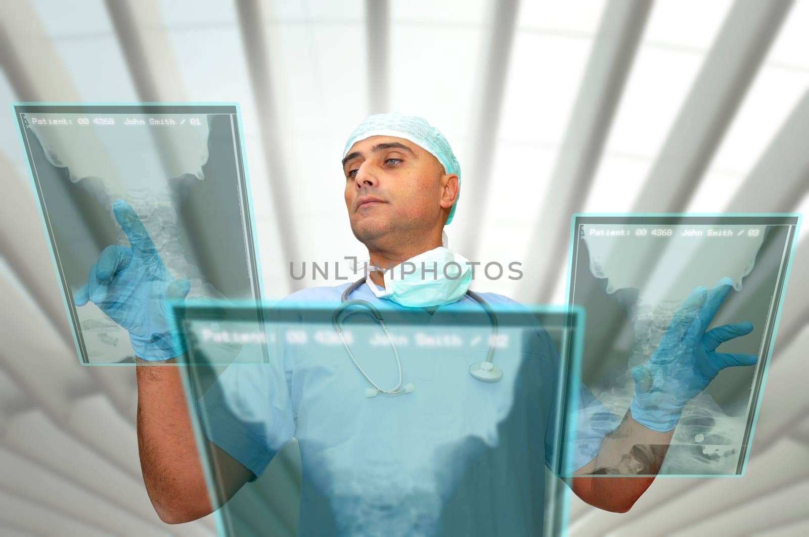 Doctor with hightech computer screen viewing patient data
