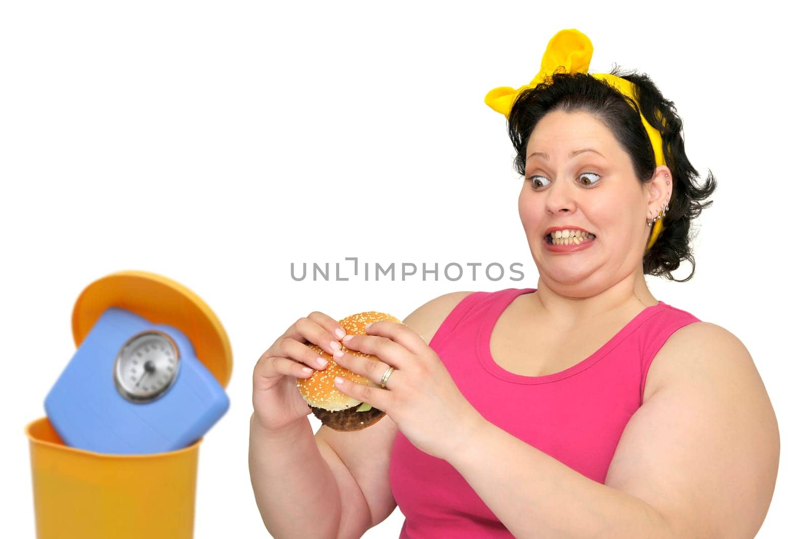 Large girl with hamburger and weight scale in the garbage bin