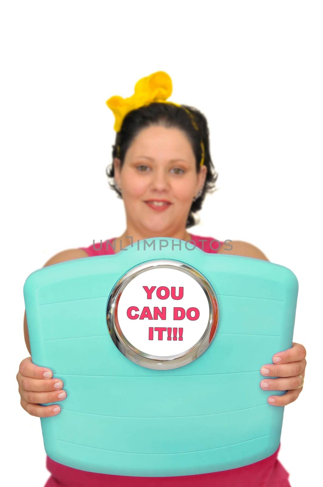 Out of focus large girl holding a scale isolated in white