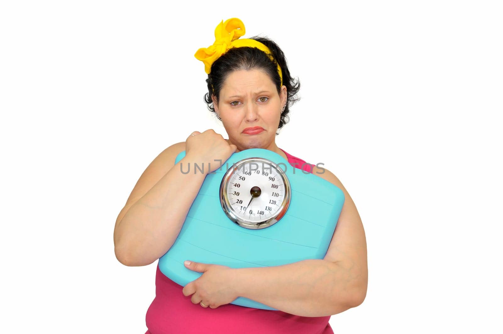Large girl with sad face and scale isolated in white