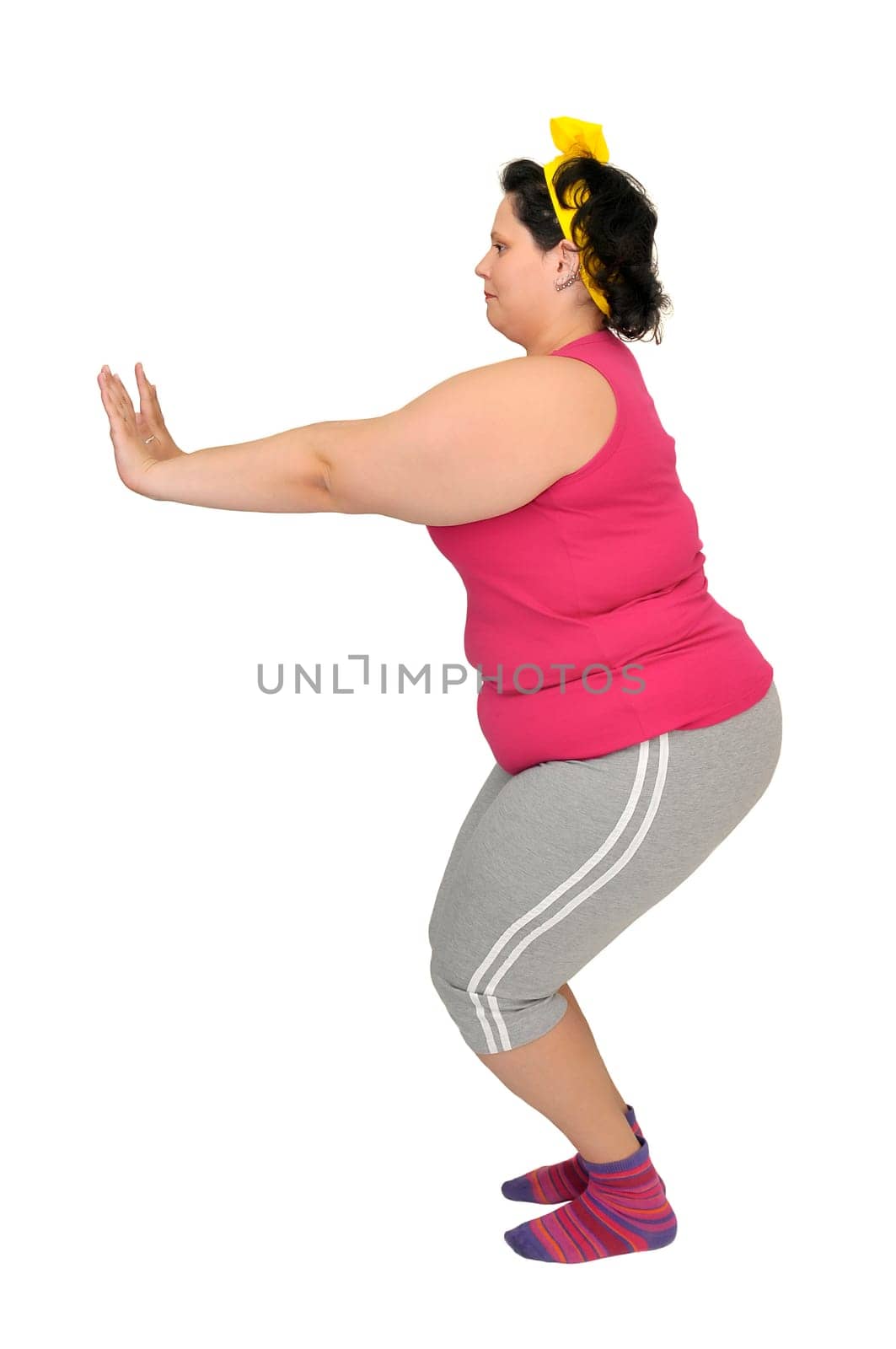 Large girl doing fitness exercises isolated in white