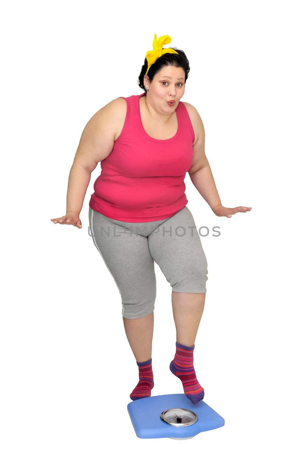 Large girl holding a scale isolated in white
