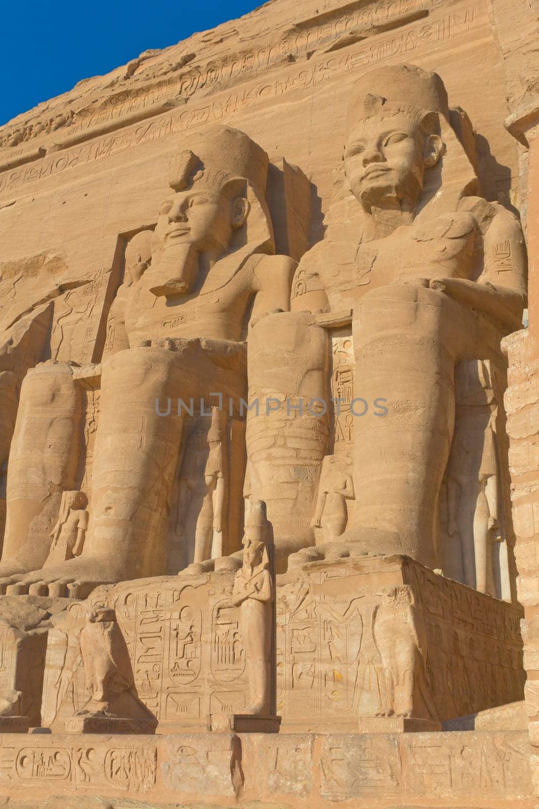 Sculptures of King Ramses II and queen Nefertari in Abu Simbel Temple (Egypt)