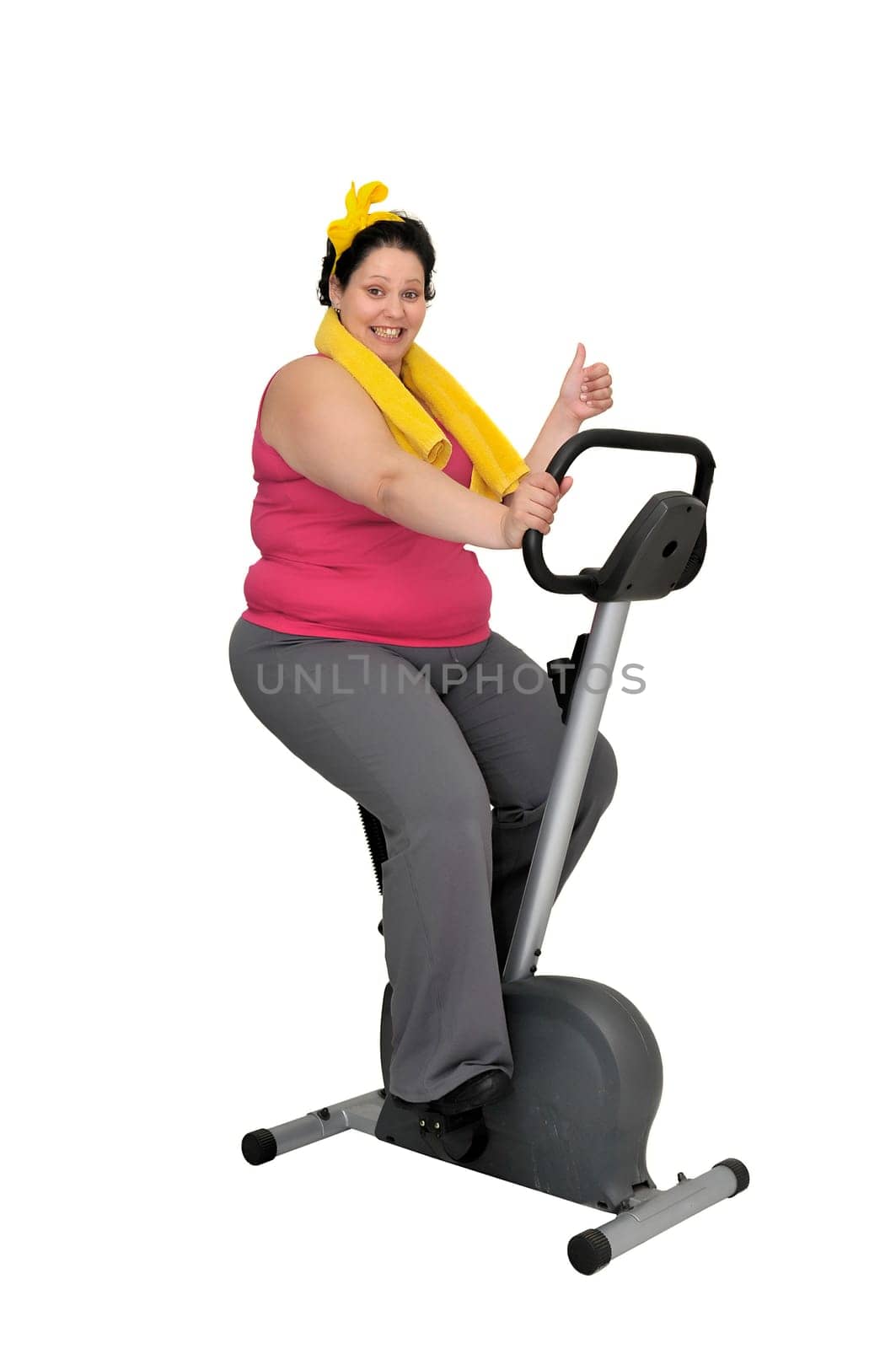 Large girl with fitness bicycle isolated in white
