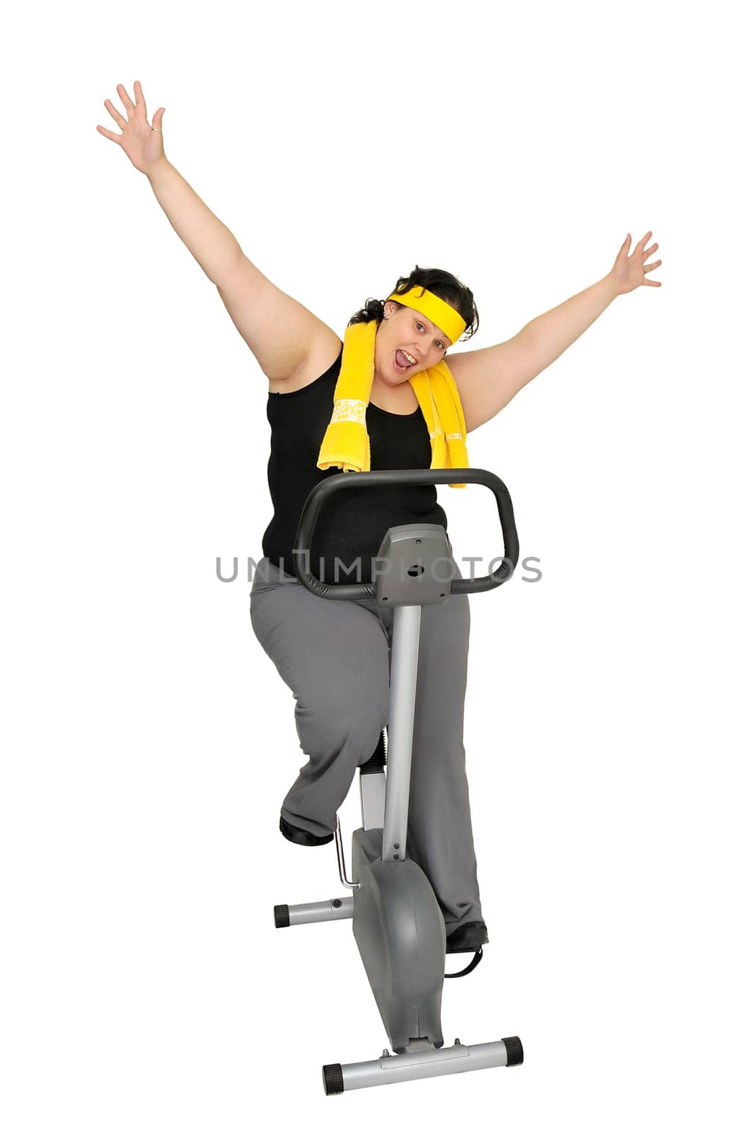 Large girl with fitness bicycle isolated in white