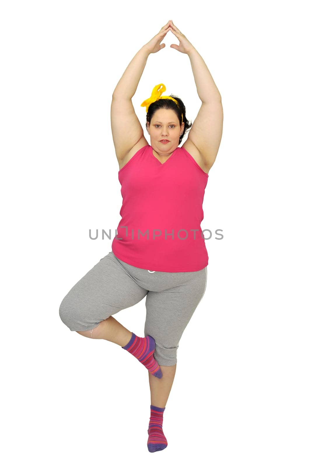 Large girl doing fitness exercises isolated in white