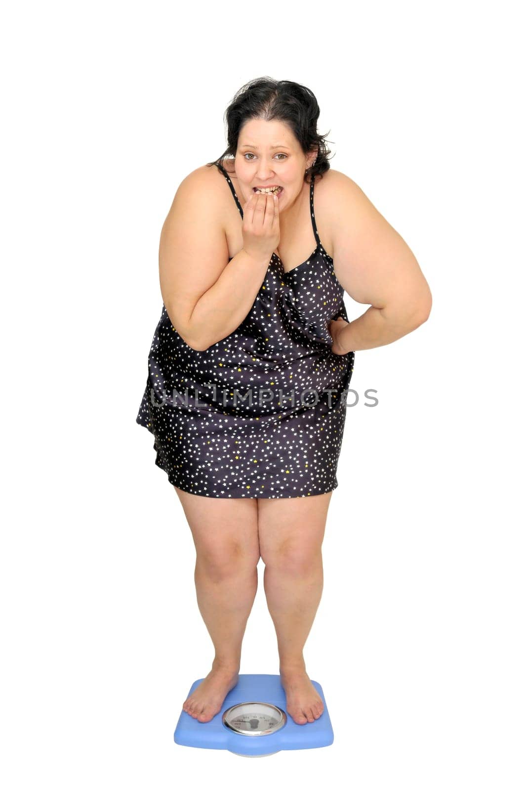 Large young woman in a scale