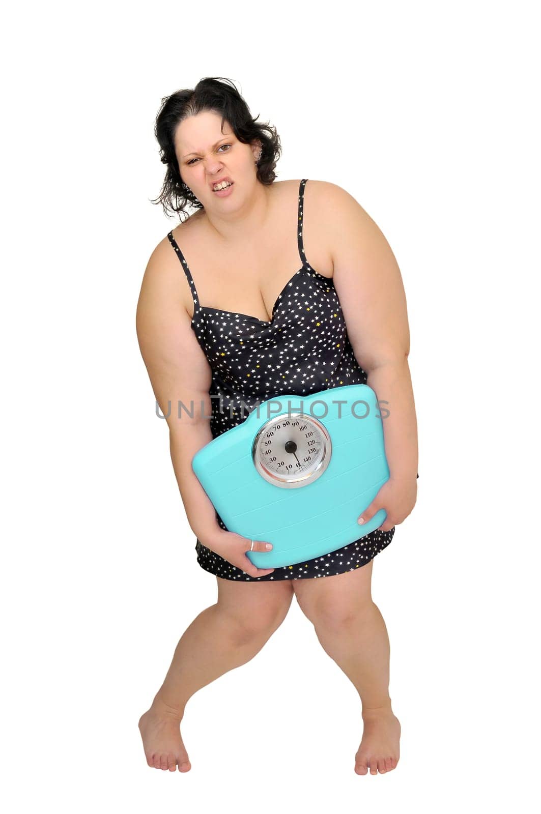 Large girl in nightie holding a scale isolated in white
