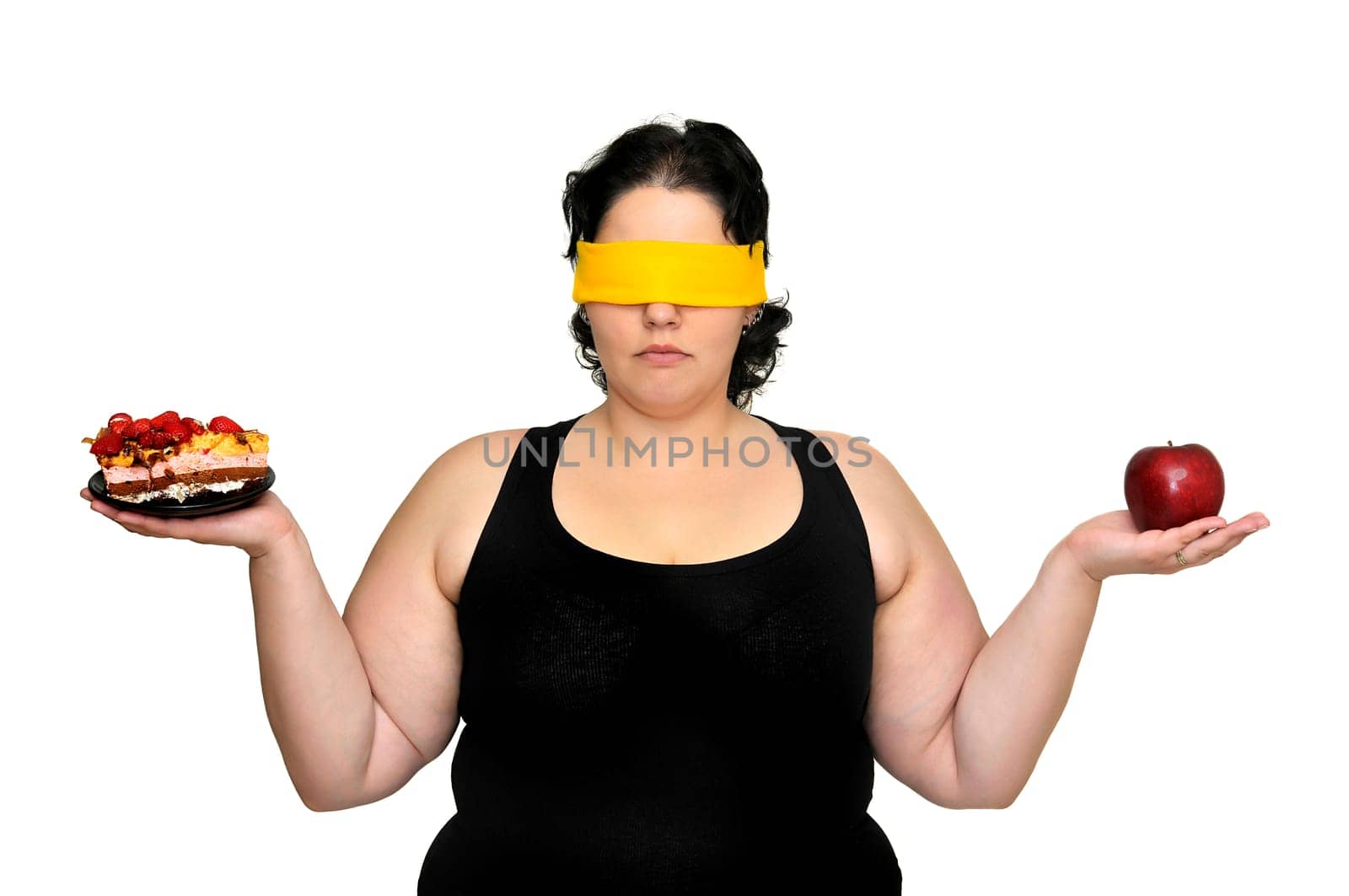 Large girl blindfolded holding a cake and an apple isolated in white