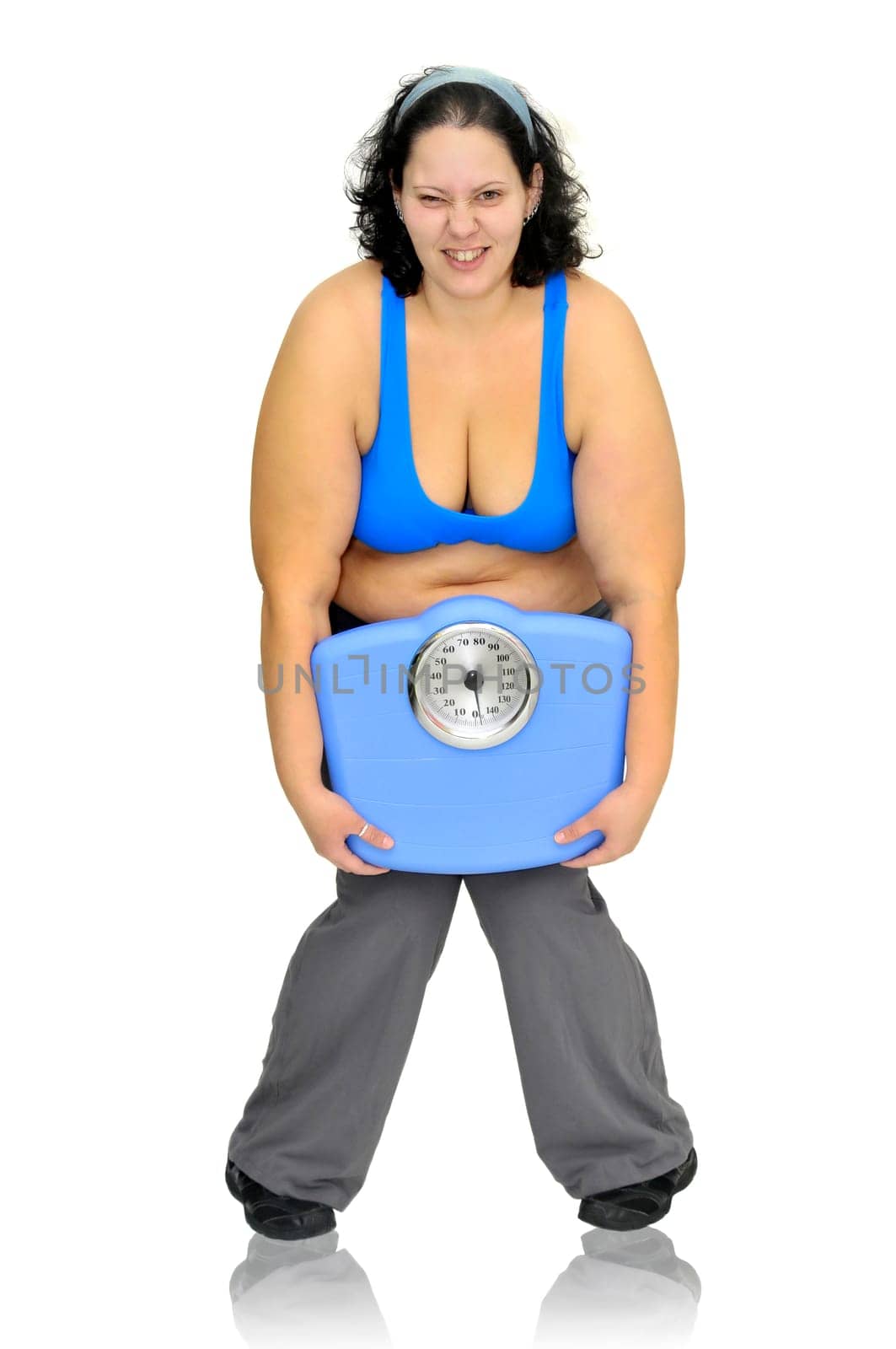 Large girl with weight scale isolated in white