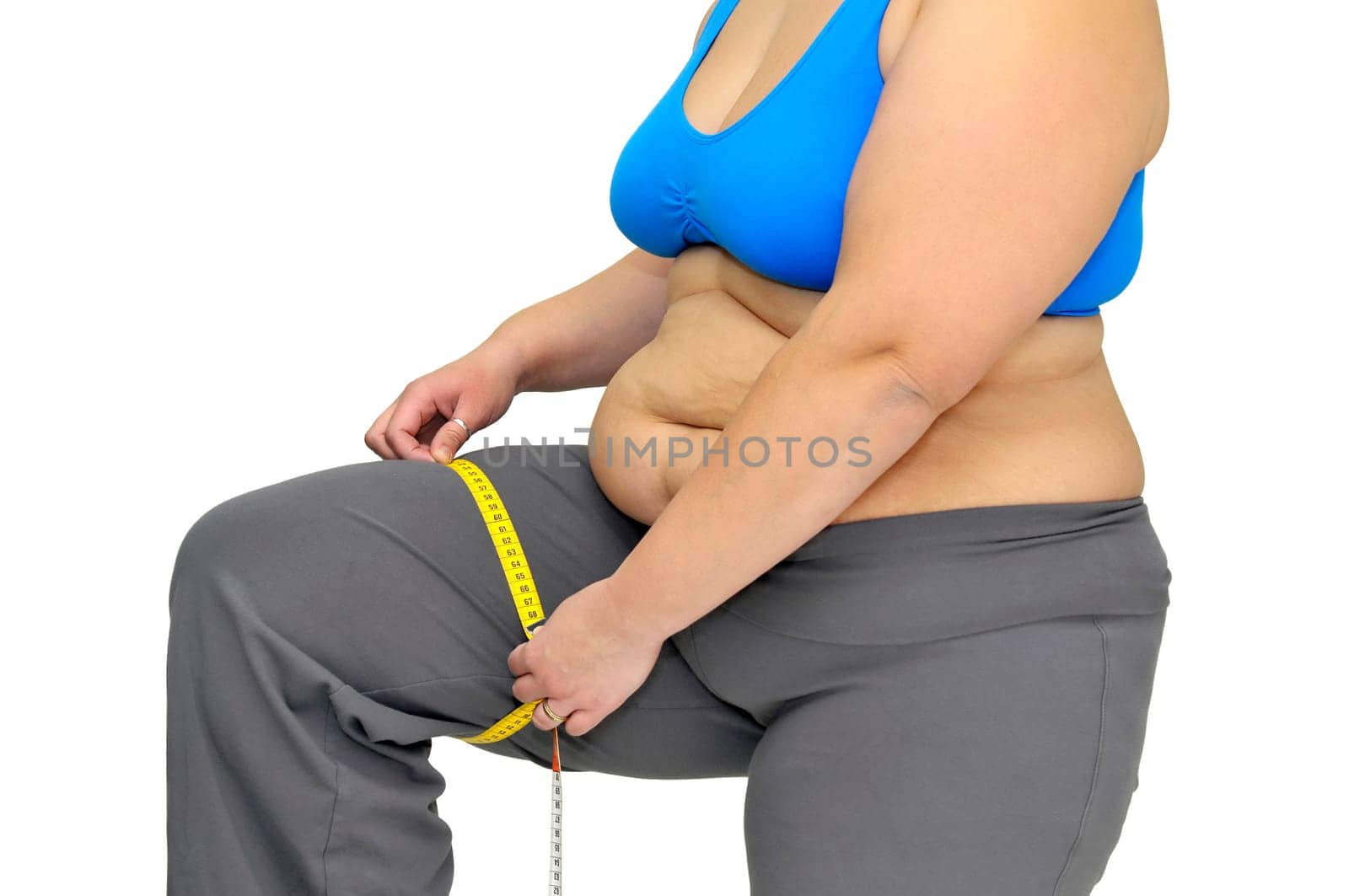 Large girl body part with measuring tape isolated in white
