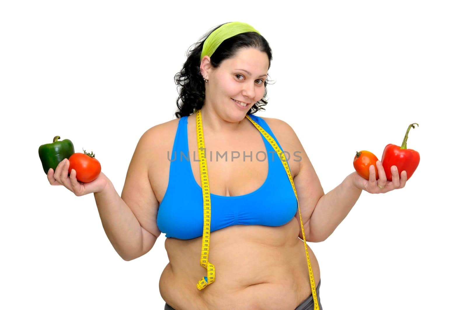 Large girl with vegetables isolated in white