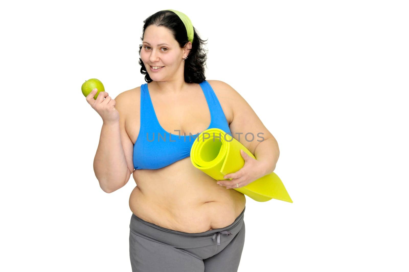 Large girl with apple isolated in white