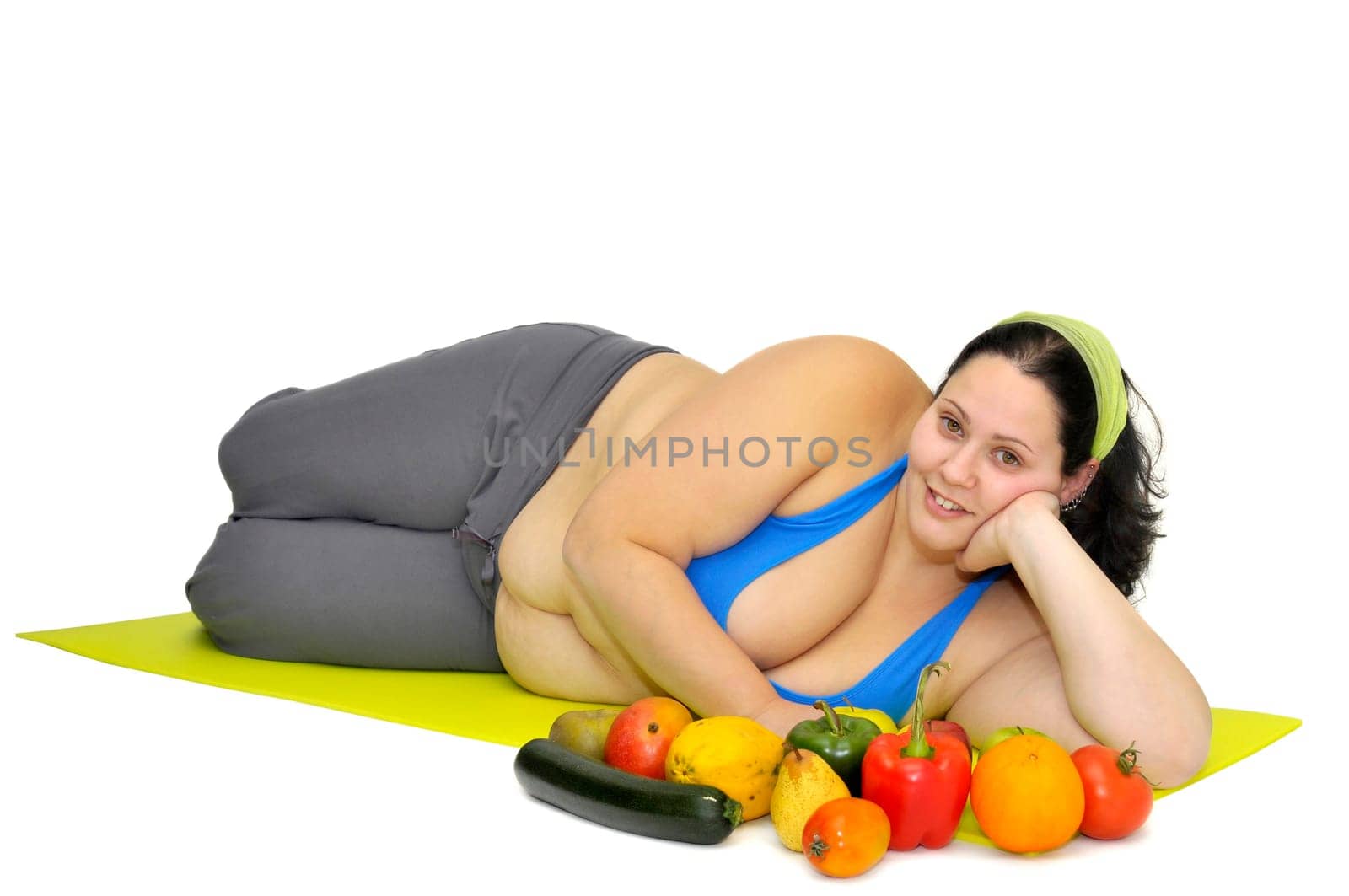 Large girl with vegetables isolated in white