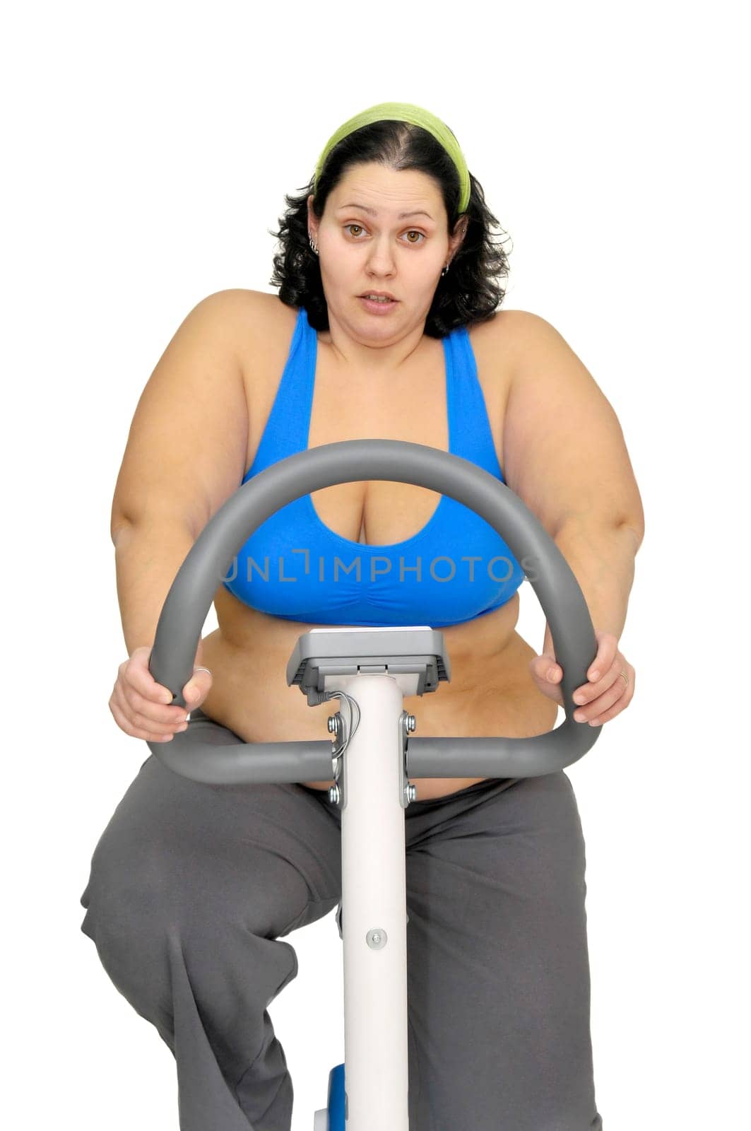 Large girl exercising isolated in white