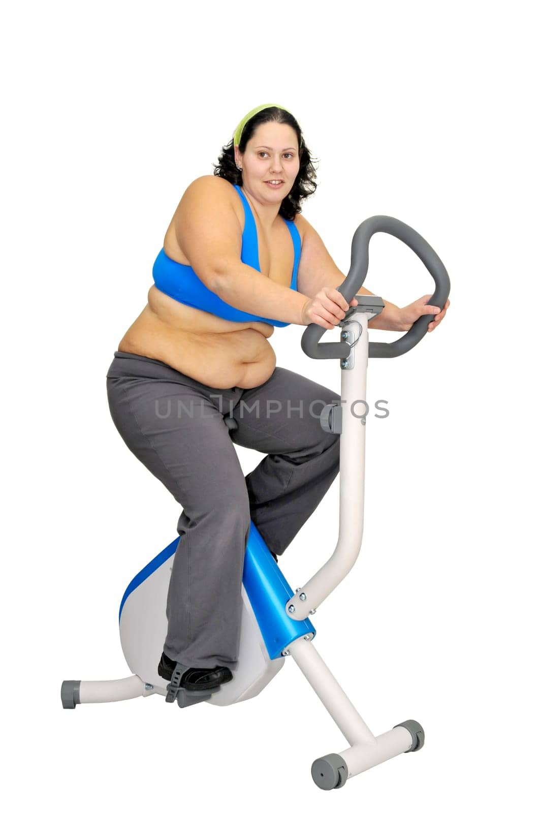 Large girl exercising isolated in white