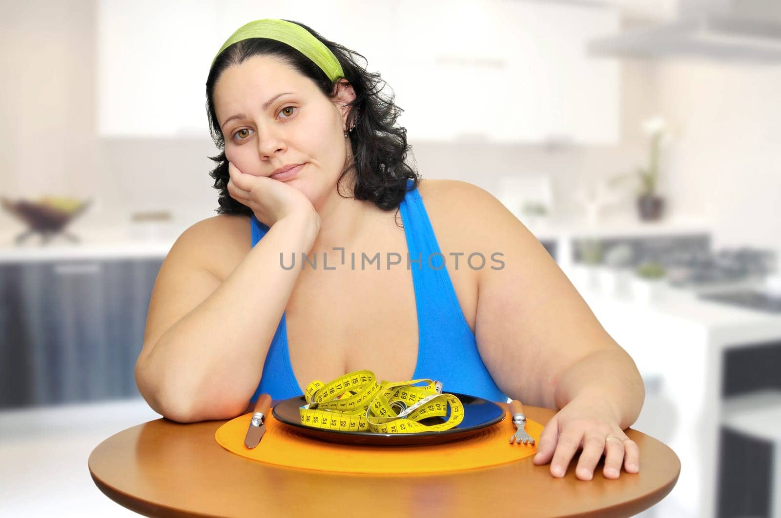 Large girl eating a measuring tape