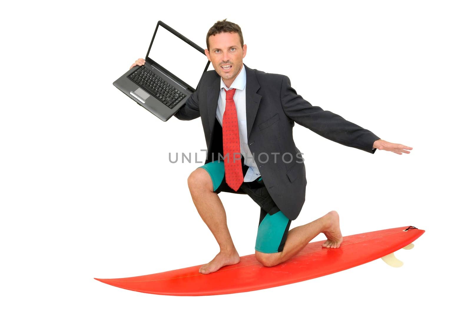 Young businessman with surf board and laptop