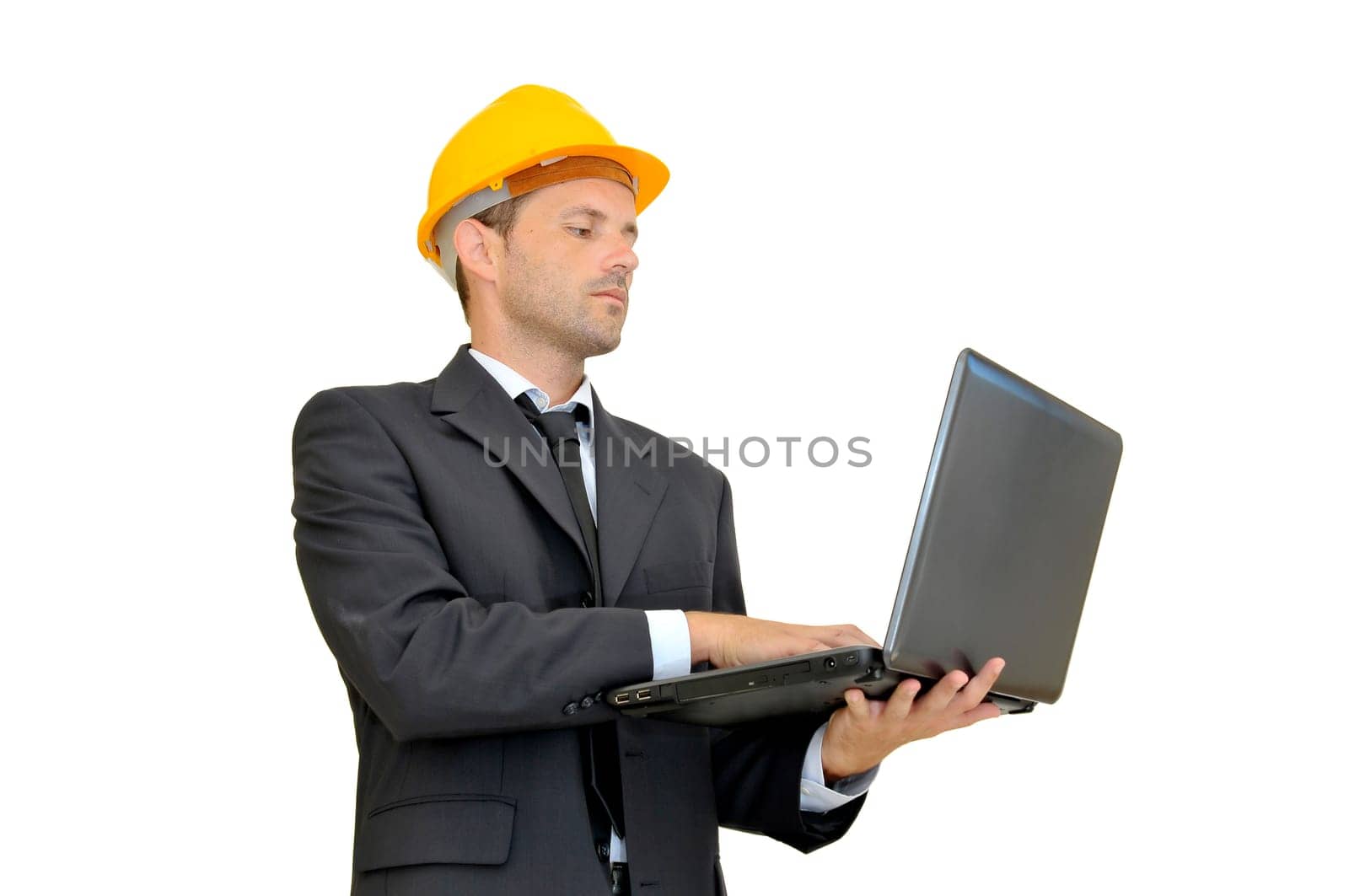 Engineer with hat and laptop isolated in white