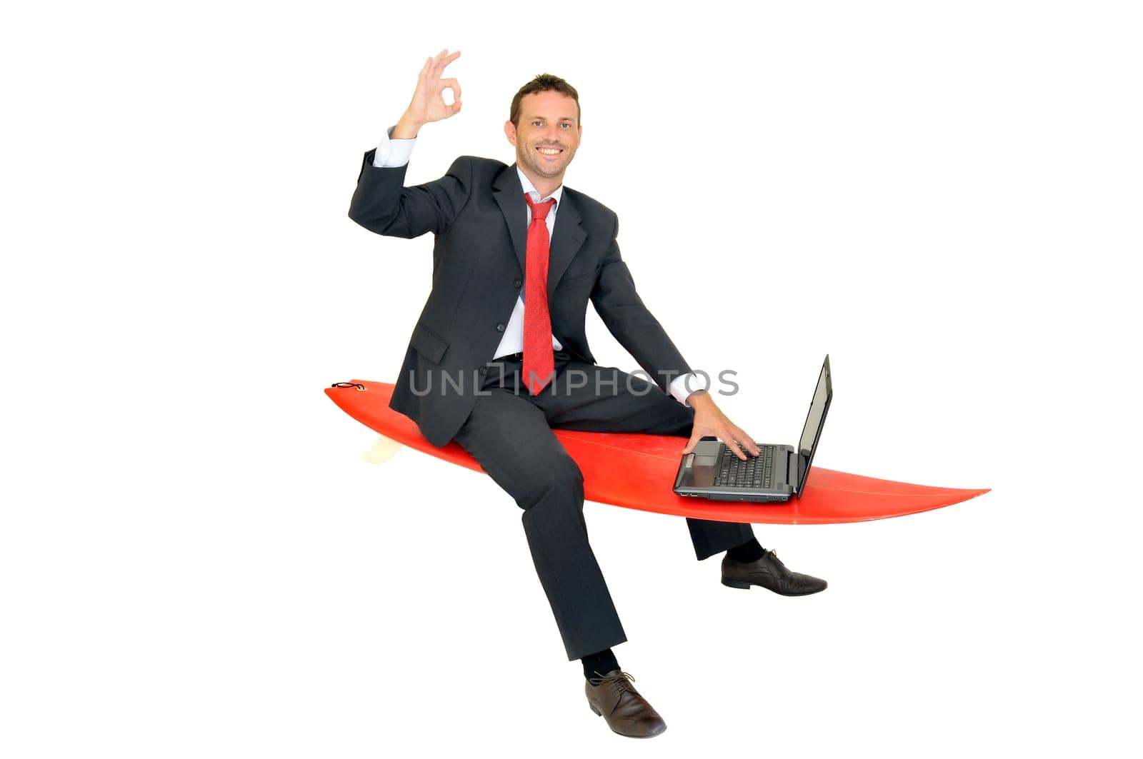 Young businessman with surf board