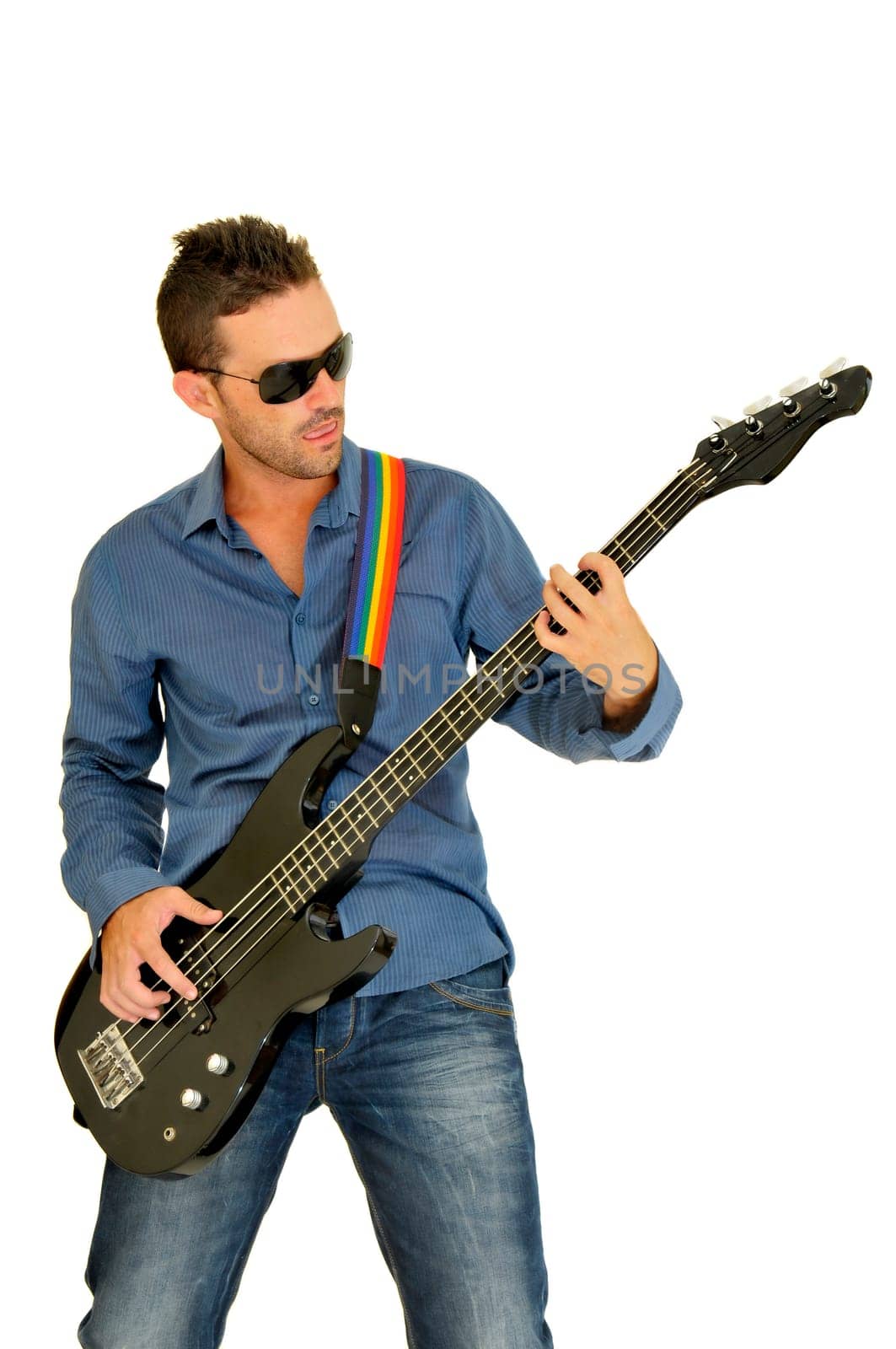 Young man posing with a guitar