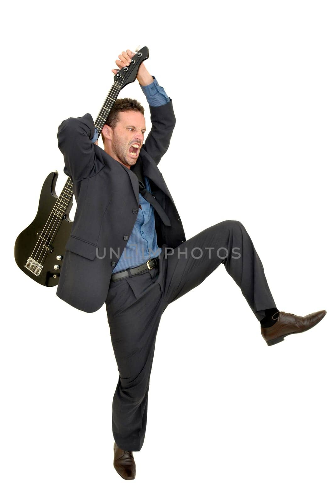 Crazy man smashing a guitar isolated in white