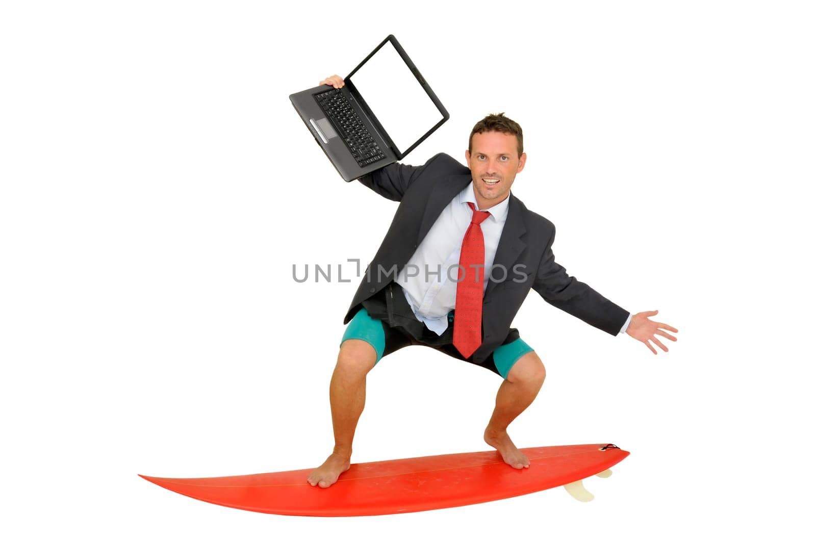 Young businessman with surf board and laptop