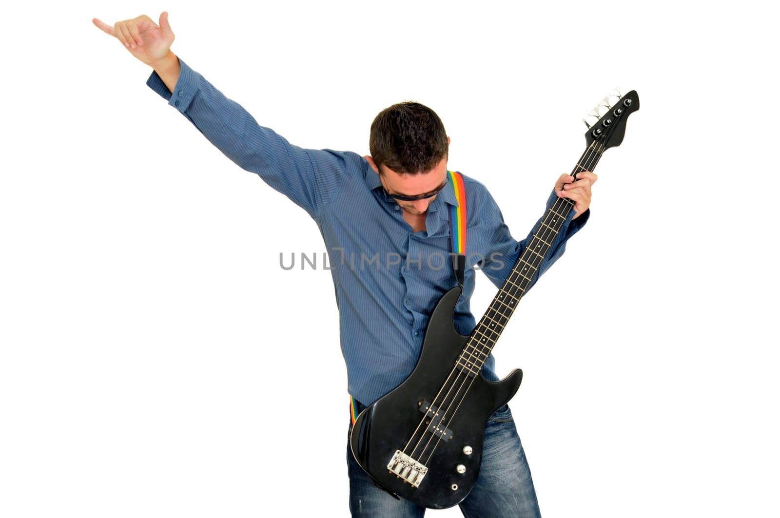 Young man posing with a guitar