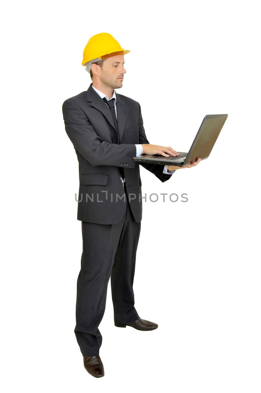 Engineer with hat and laptop isolated in white