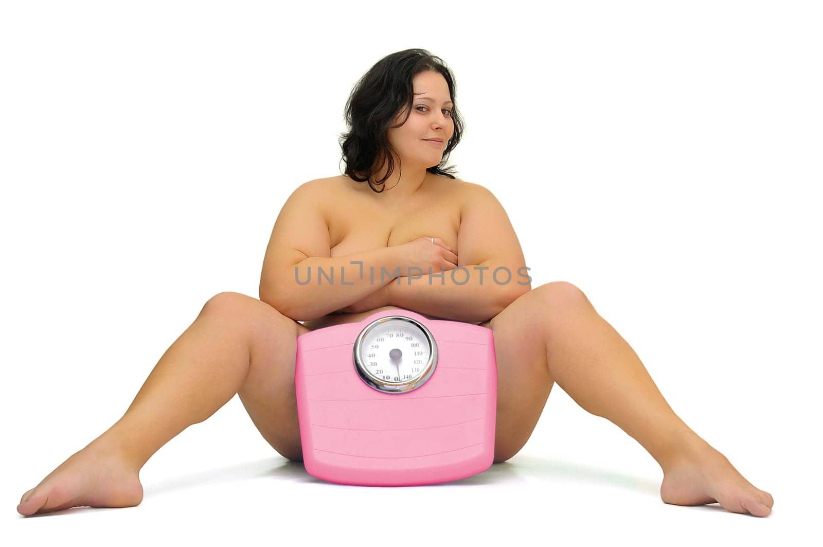 Beautiful nude large girl with weight scale isolated in white