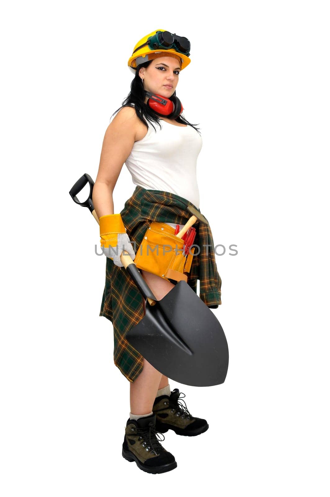 Young sexy construction worker girl with a shovel isolated in white