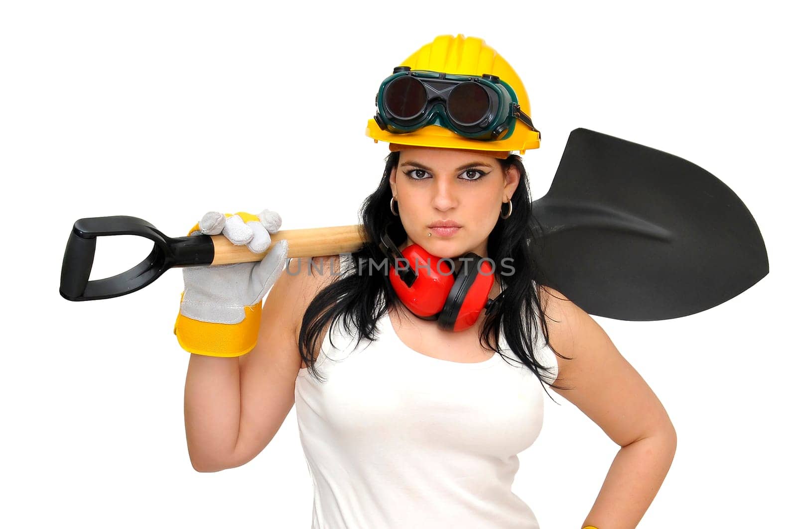 Young sexy construction worker girl with a shovel isolated in white