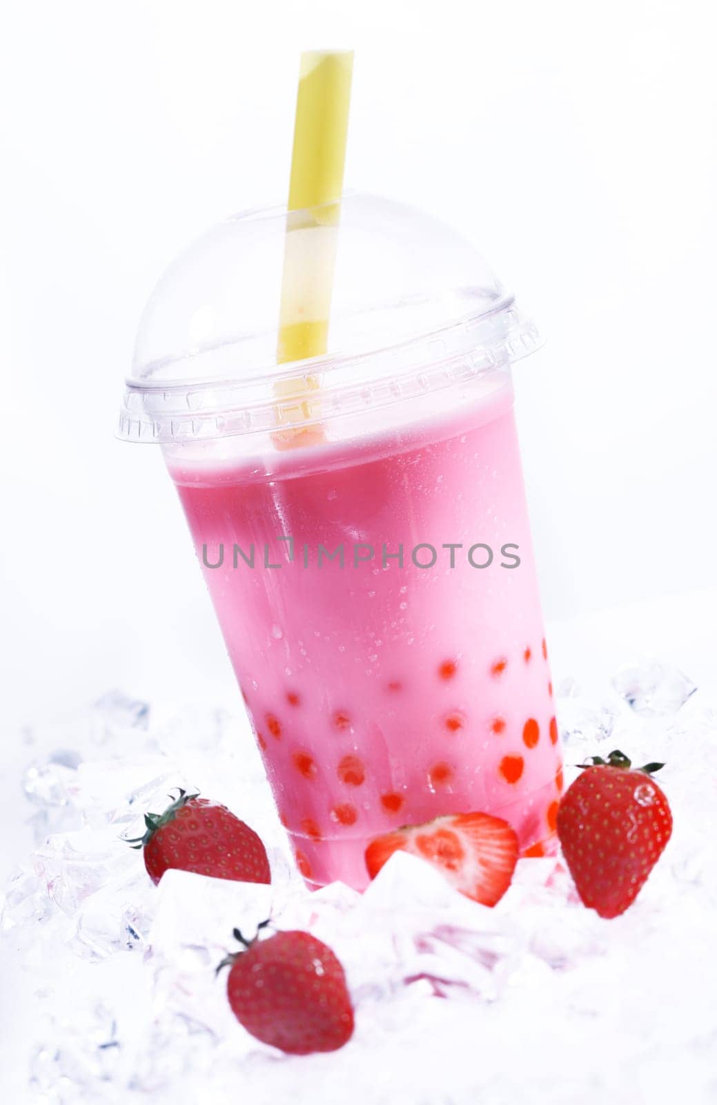 Strawberry Boba Bubble Tea with fruits and crushed ice.