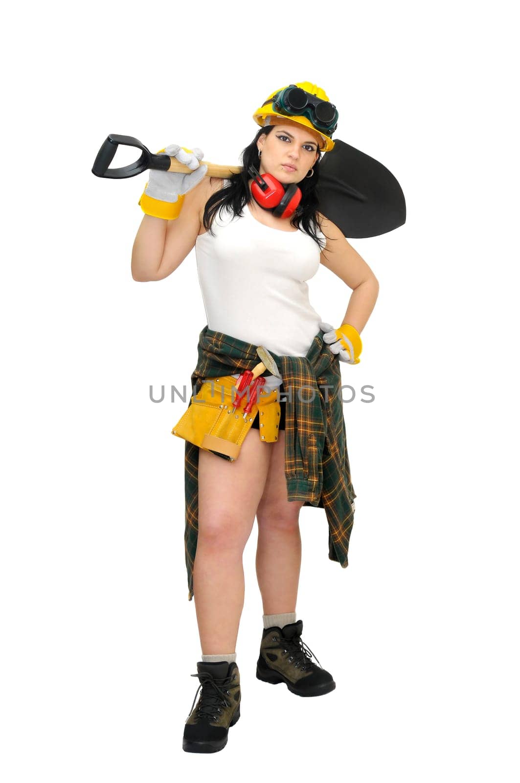 Young sexy construction worker girl with a shovel isolated in white