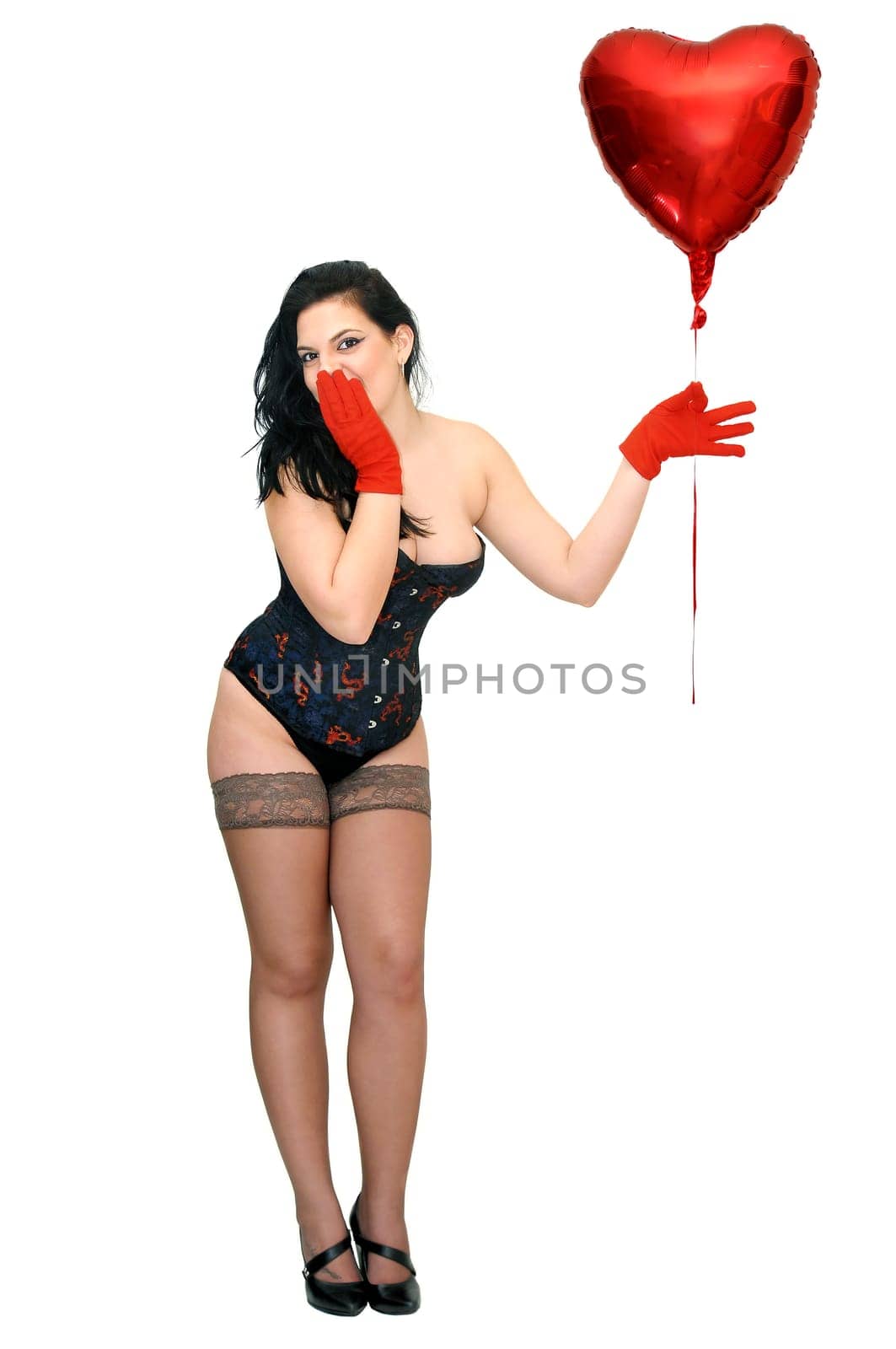 Sexy woman with red balloon isolated in white
