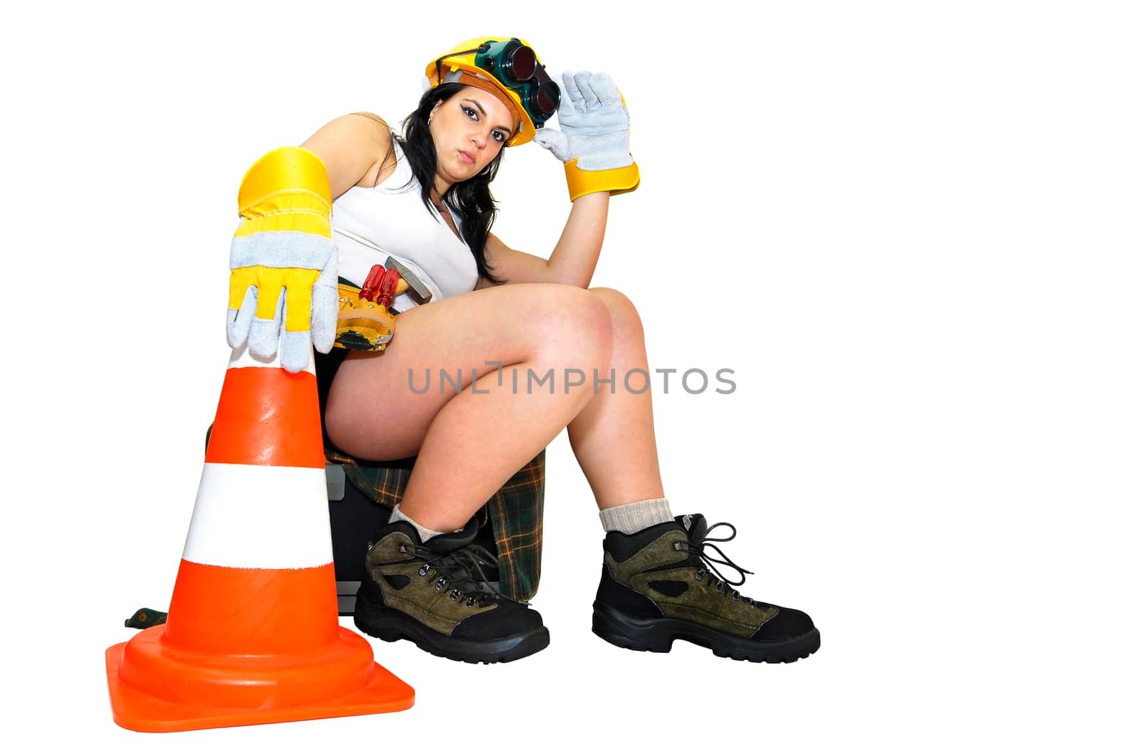 Young sexy construction worker girl isolated in white