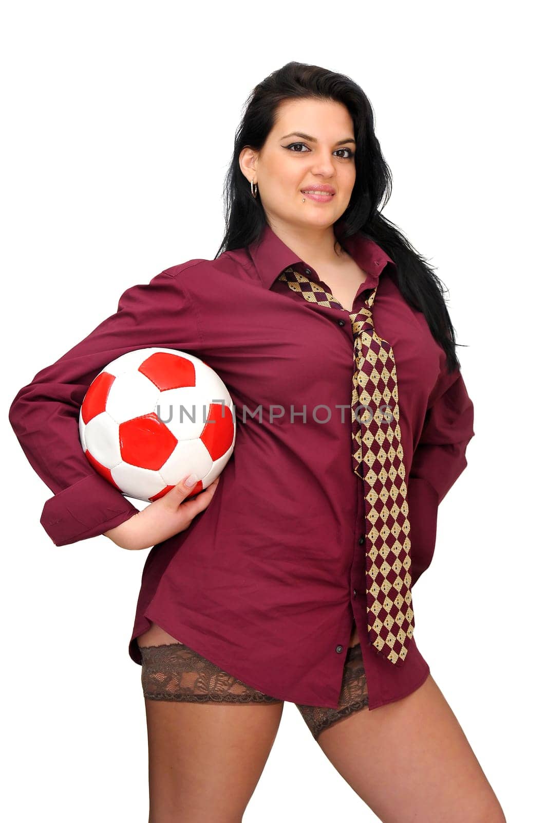 Sexy businesswoman with soccer ball isolated in white