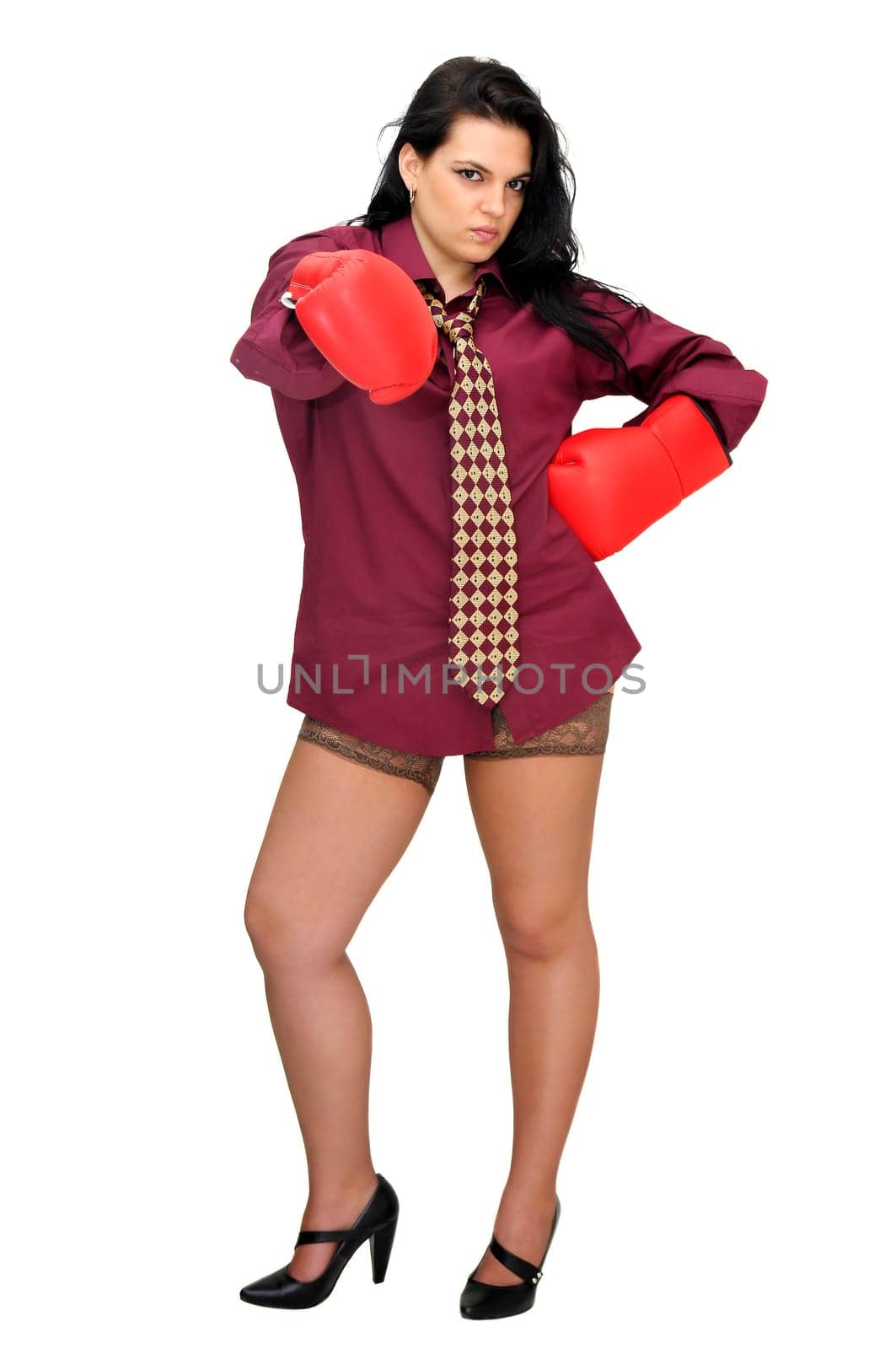 Sexy businesswoman with boxing gloves isolated in white
