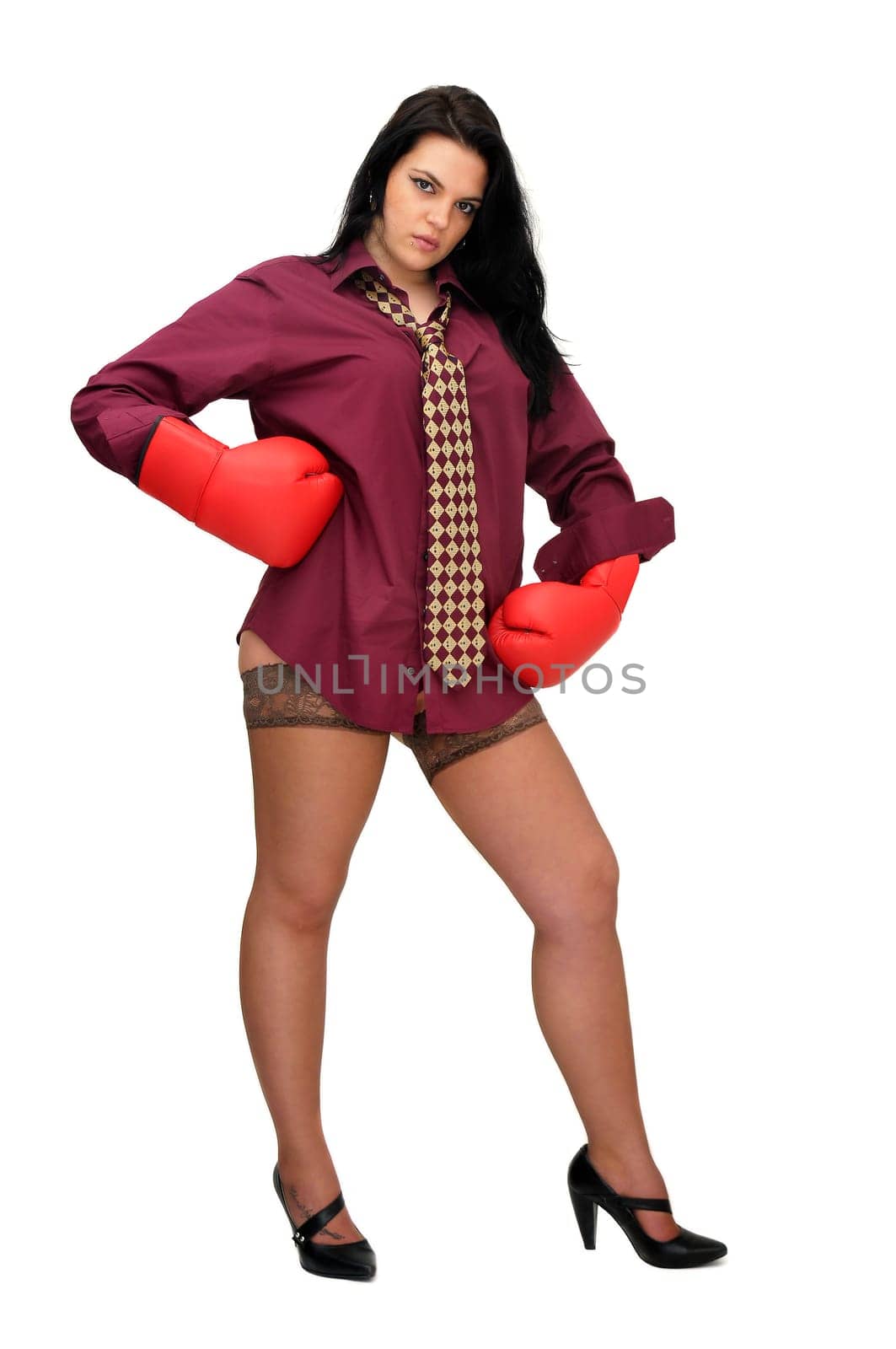 Sexy businesswoman with boxing gloves isolated in white
