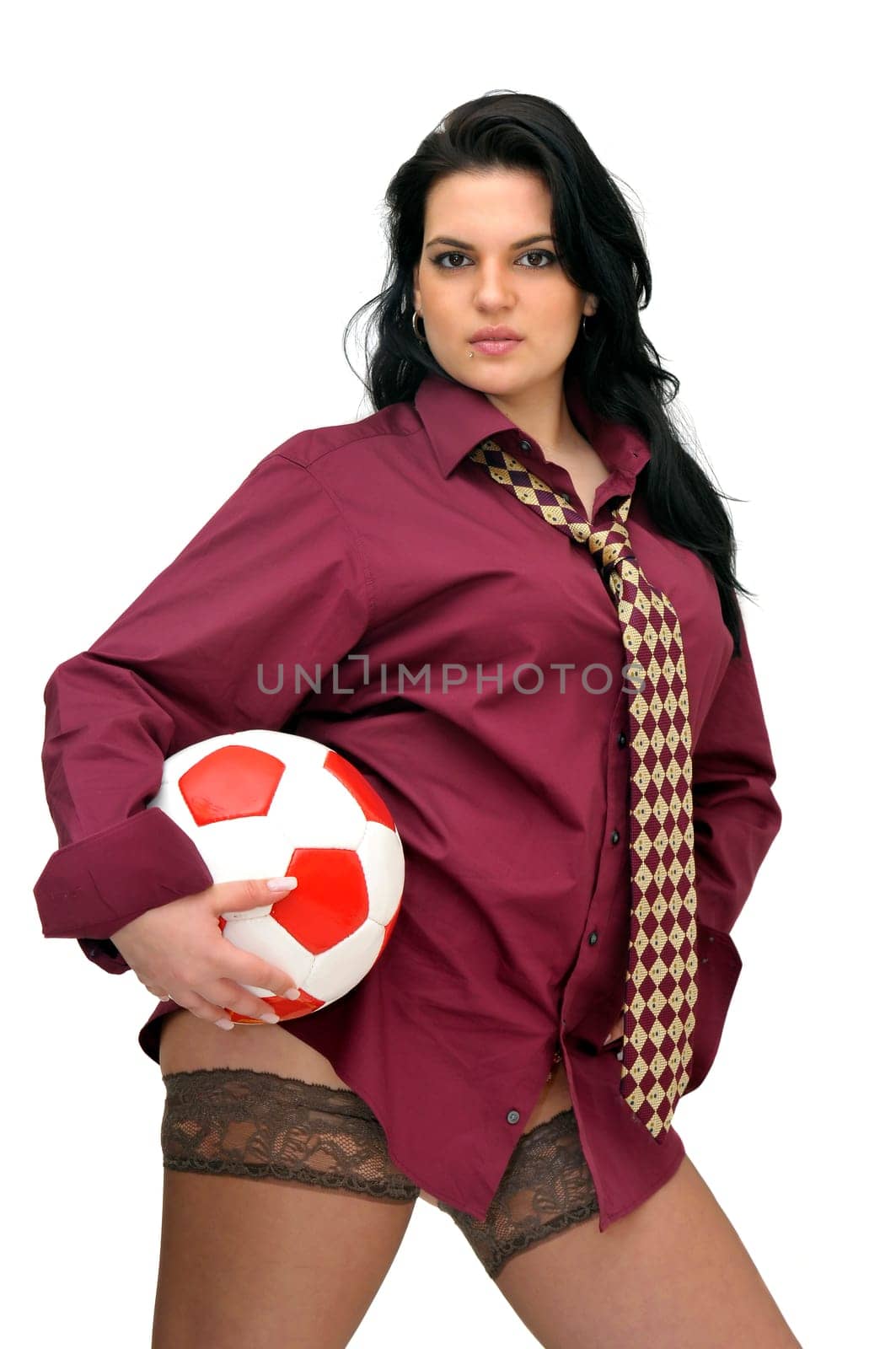 Sexy businesswoman with soccer ball isolated in white