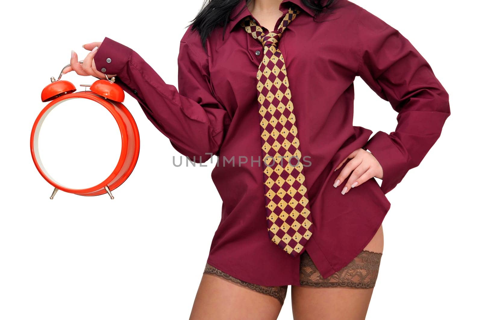 Sexy businesswoman with big red clock isolated in white
