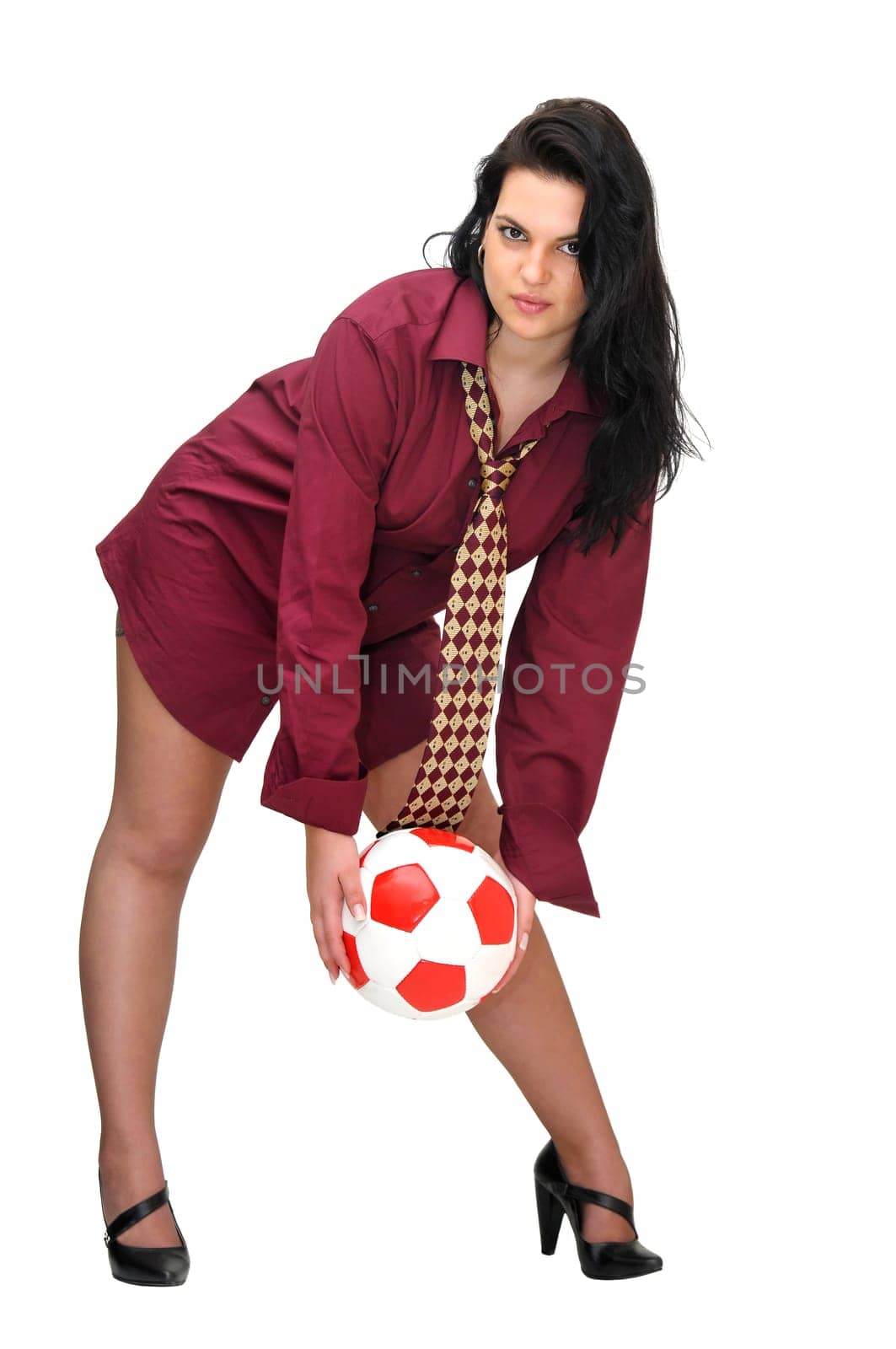 Sexy businesswoman with soccer ball isolated in white