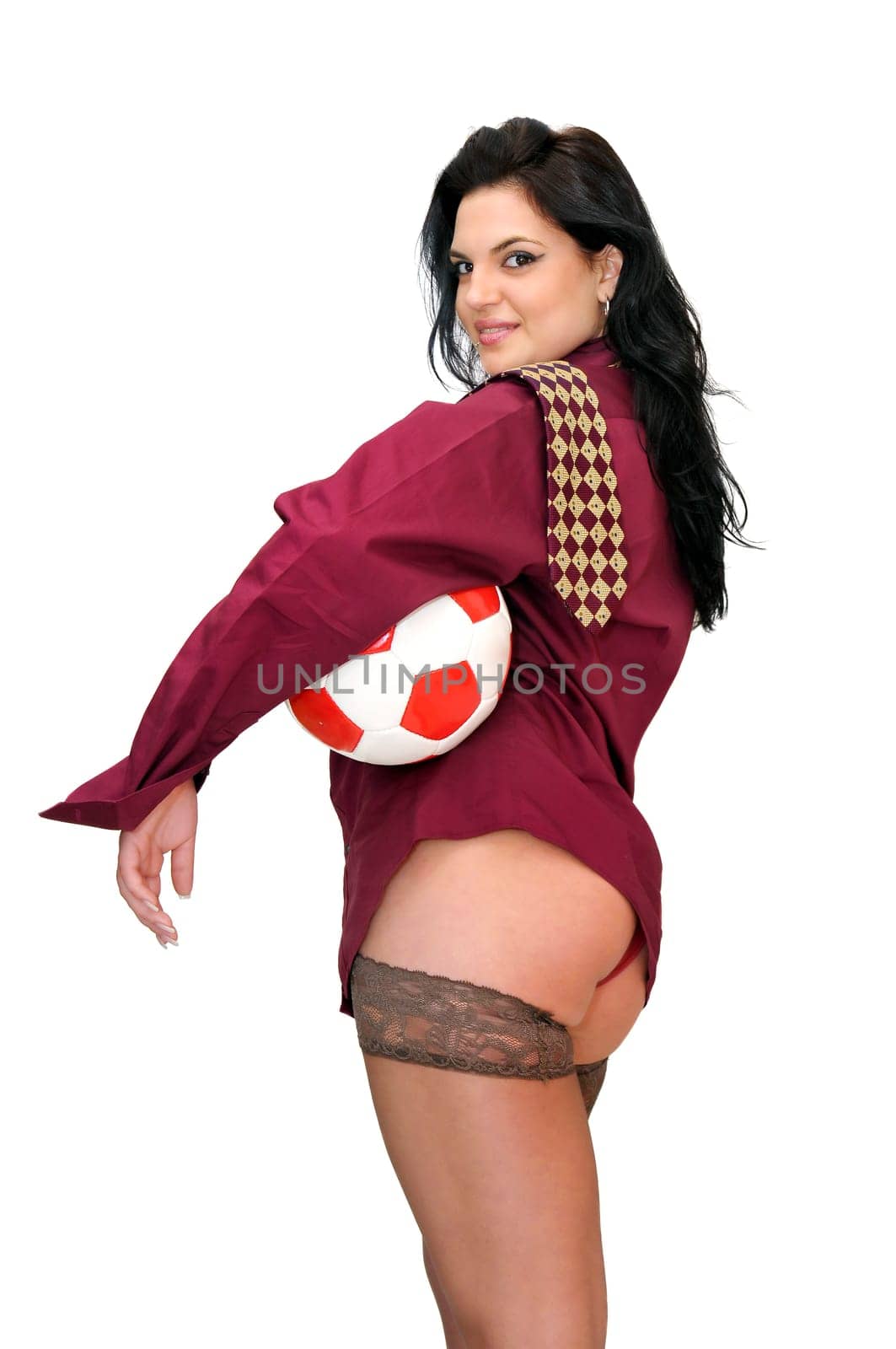 Sexy businesswoman with soccer ball isolated in white
