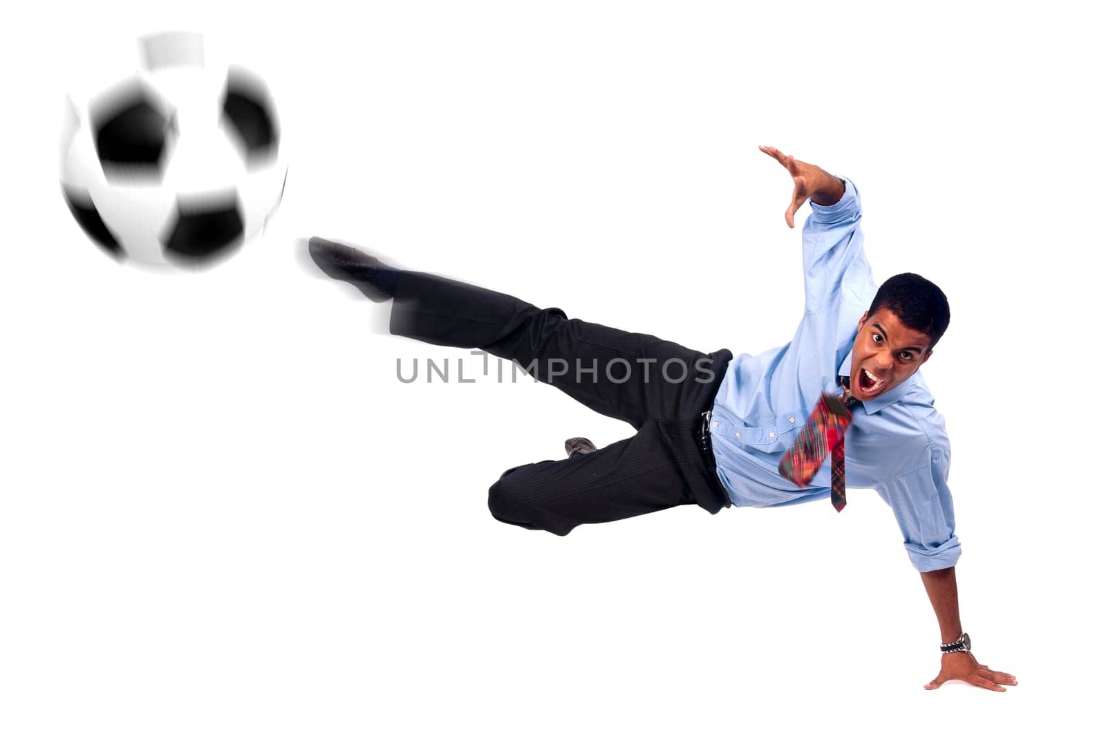 Businessman playing soccer isolated in white