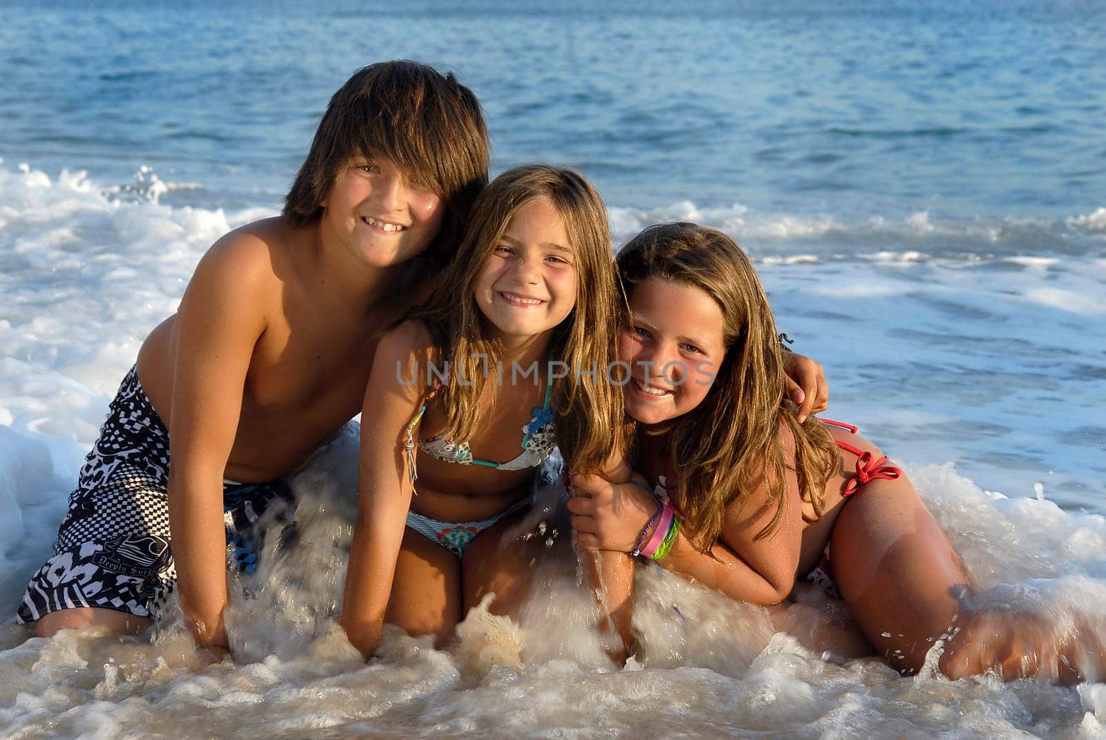 Three brothers posing in the beach